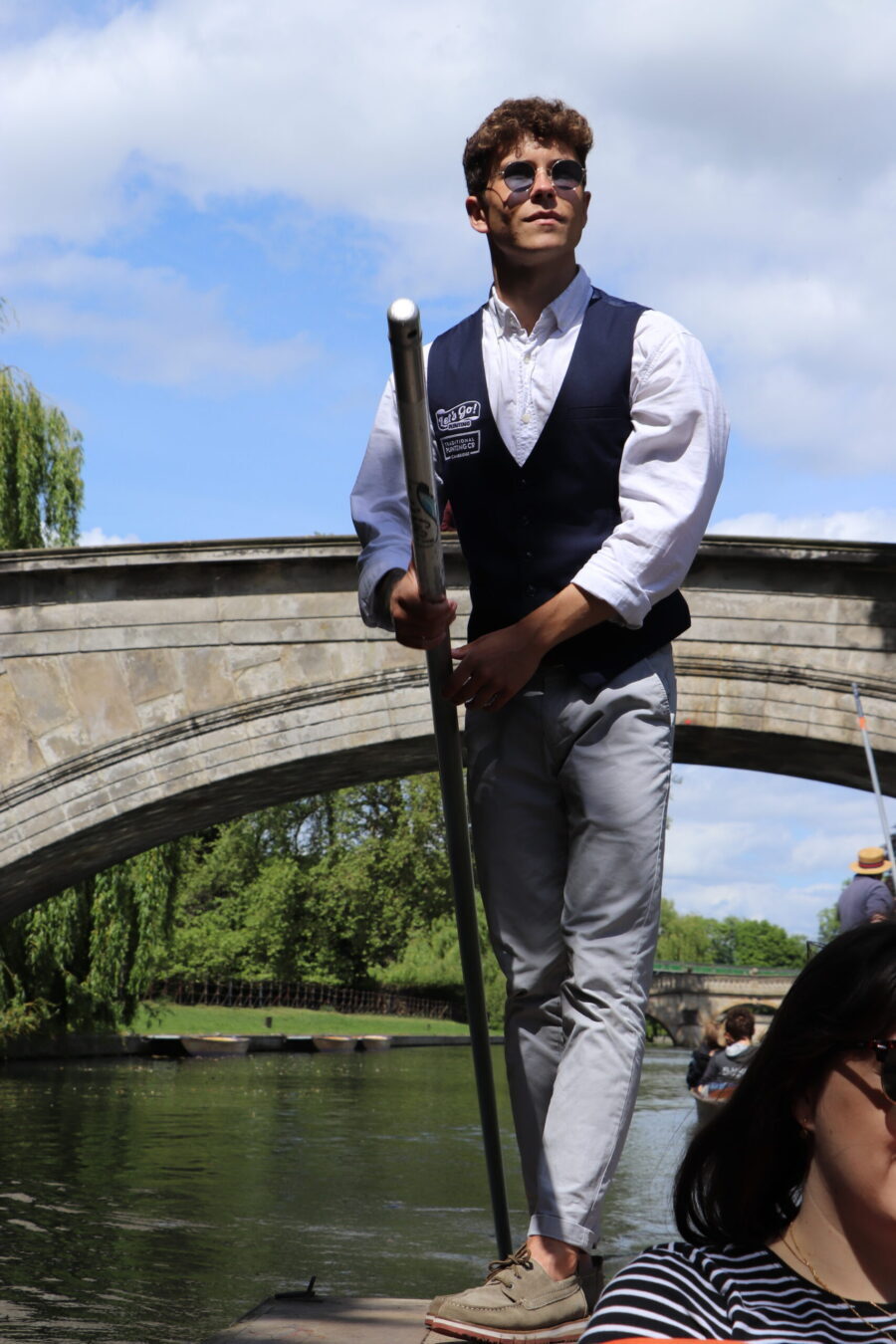 A trained punter standing on the helm punting the boat, Kings Bridge