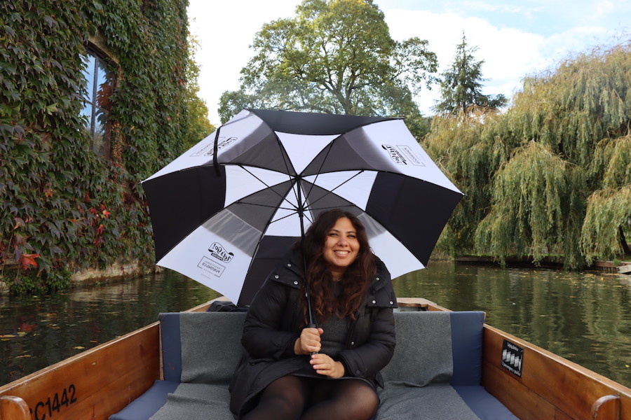 Punting in the rain with provided umbrella